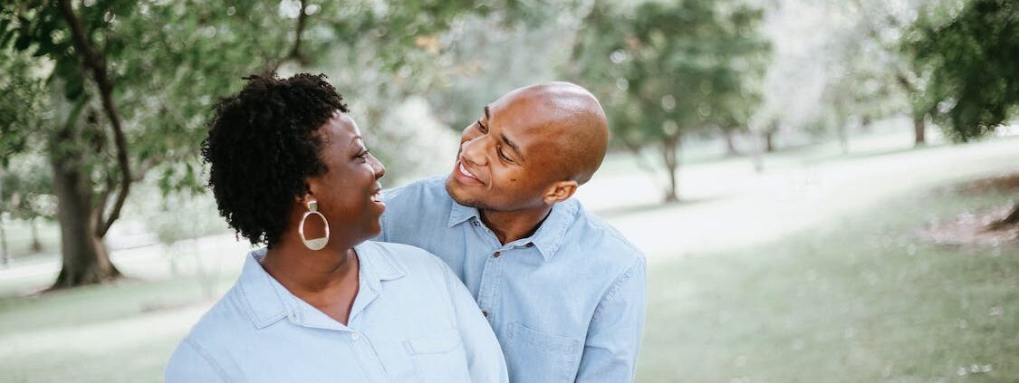 A couple looking at each other and smiling