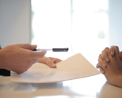 An estate planning attorney discussing wills and trusts with a client